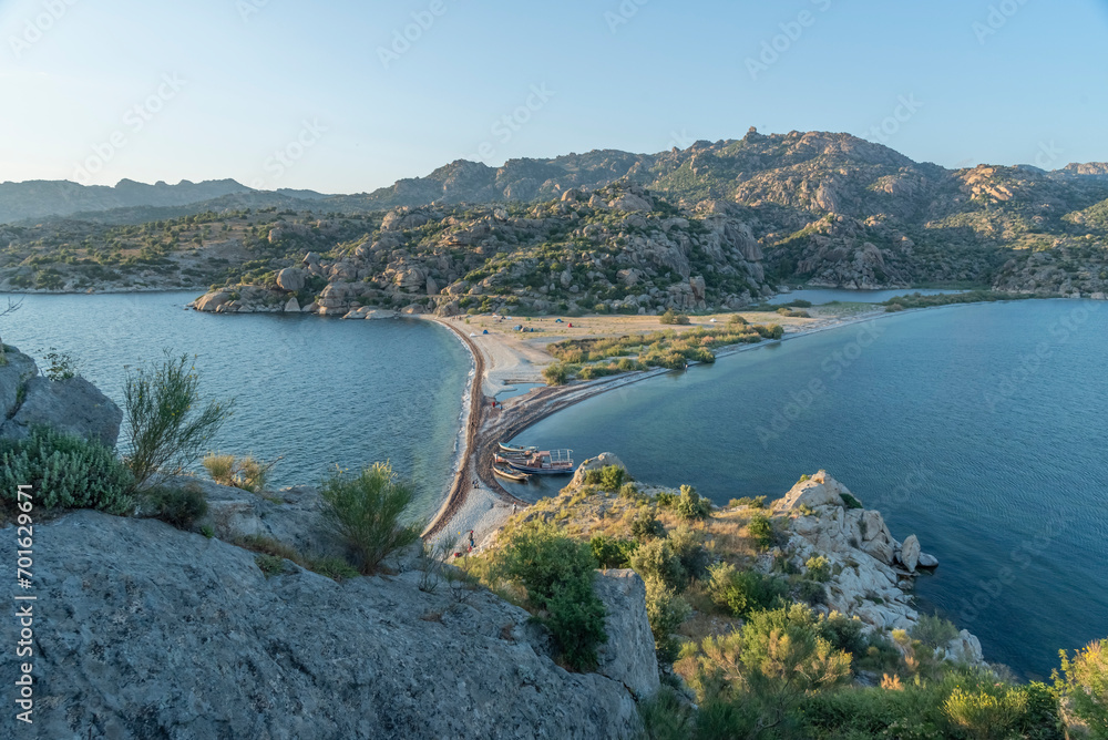Ancient settlements and places of worship around Lake Bafa with different rock forms and religious drawings - obrazy, fototapety, plakaty 