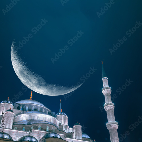 Sultanahmet or Blue Mosque with crescent moon. Islamic concept image photo