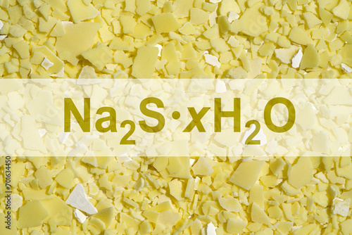 Sodium sulfide flake with chemical formula. Chemical used in the pulp and paper industry, water treatment, textile industry, and various chemical manufacturing process. photo