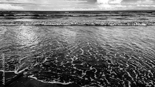 Wave and sandy beach in black and white. Calm view during sunset at Pantai Anak Air, Kuantan Pahang, Malaysia.
 photo