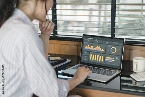 Businesswoman or accountant team analyzing data charts, graphs, and dashboard on laptop screen to increase sales and revenue. Business data analytics concept.