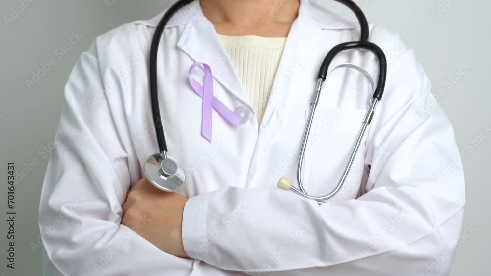 Doctor with purple ribbon for world cancer day, lupus, Pancreatic, Esophageal, Testicular cancer, world Alzheimer, epilepsy, Sarcoidosis, Fibromyalgia and domestic violence Awareness month concepts Doctor with purple ribbon for world cancer day, lupus, Pancreatic, Esophageal, Testicular cancer, world Alzheimer, epilepsy, Sarcoidosis, Fibromyalgia and domestic violence Awareness month concepts