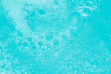 Soap bubbles wallpaper in transparent blue water. defocus not clear details