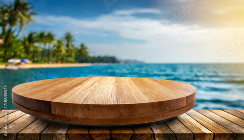 Vacant circular wooden display platform positioned on a rock overlooking the seascape