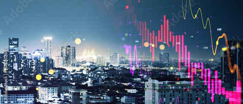 Abstract wide night city background with falling forex chart. Crisis, finance and trade concept. Double exposure.