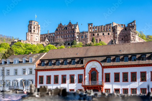 Germany, Baden-Wurttemberg, Heidelberg, Old town houses on Karlsplatz square with ruins of Heidelberg Castle in background photo