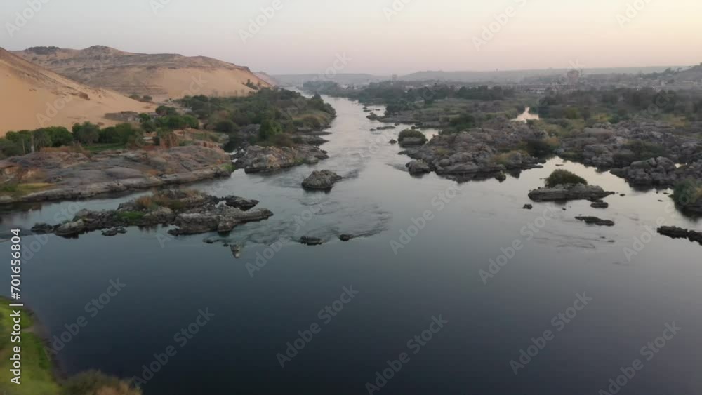 Aerial Drone FPV shot of Nile River Rock Islands at Sunrise in Aswan, Egypt Aerial Drone FPV shot of Nile River Rock Islands at Sunrise in Aswan, Egypt