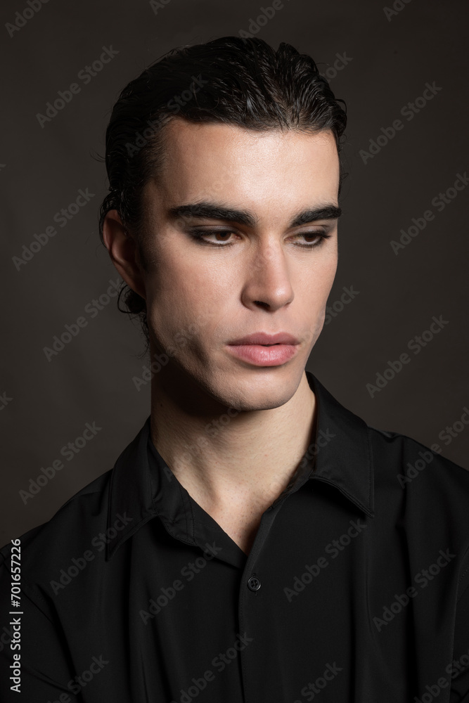 Thoughtful man against black background Thoughtful man against black background