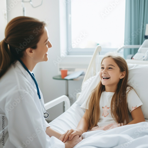 Female doctor talking to a girl patient in the hospital.