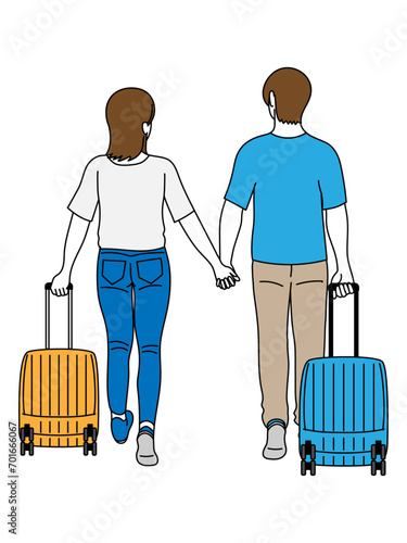 スーツケースを持った旅行中の夏服のカップル