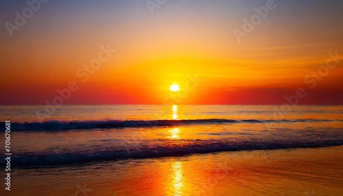 Shoreline Serenade: Tranquil Tropical Beach Under the Warm Embrace of a Golden Orange Sunset