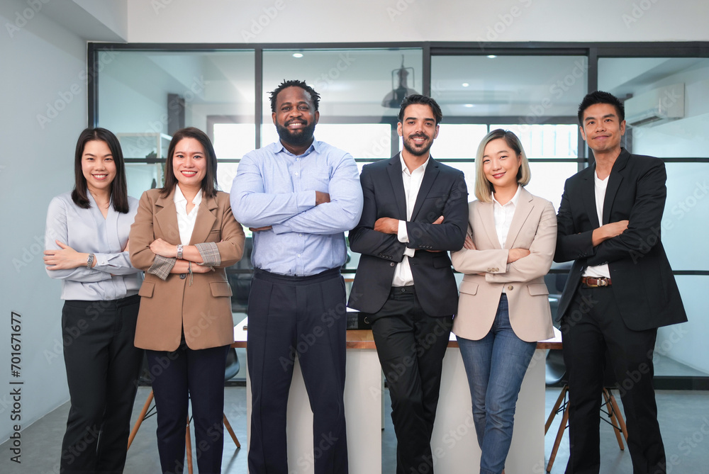 portrait group of multiracial business people standing crossed arms in the office portrait group of multiracial business people standing crossed arms in the office