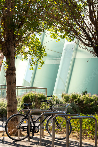 Bicycle parked in an ecological environment with contemporary architecture photo
