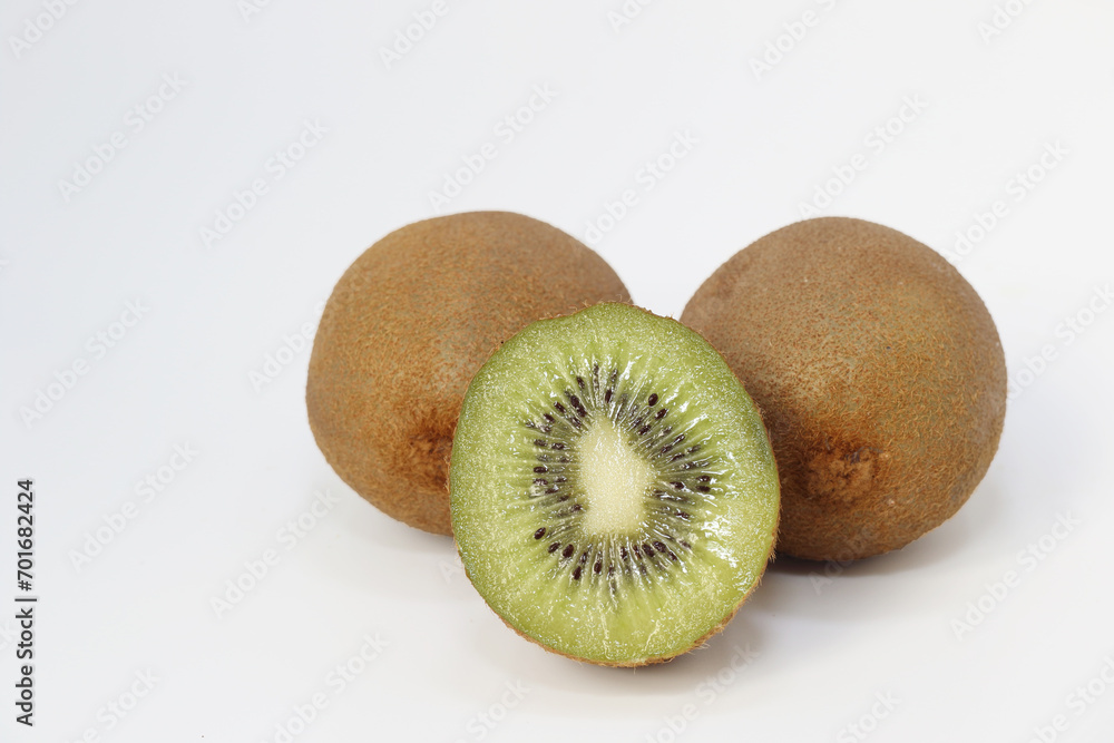 half and whole kiwis isolated on white background half and whole kiwis isolated on white background