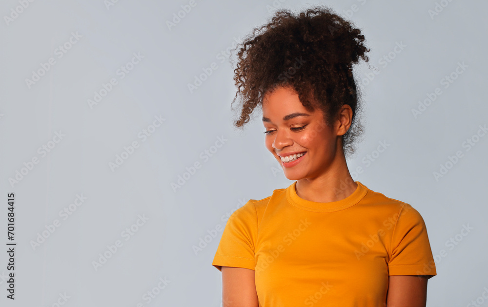 Overjoyed african american woman laughing and expressing positive emotions Overjoyed african american woman laughing and expressing positive emotions