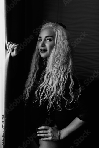Portrait of a young beautiful blonde girl in vintage style. Black and white photo. © shymar27