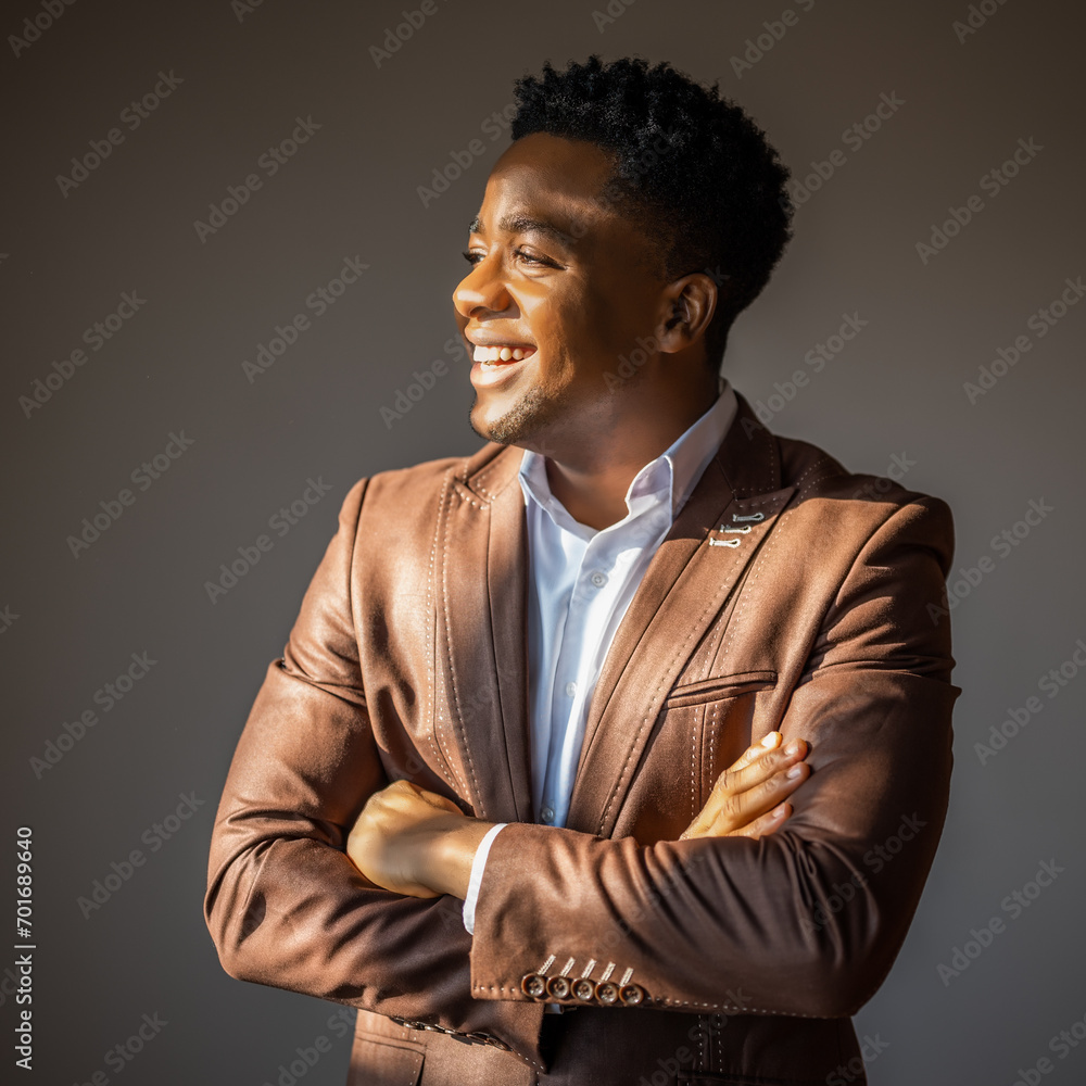 Obraz premium Portrait of happy businessman who is smiling and looking away.