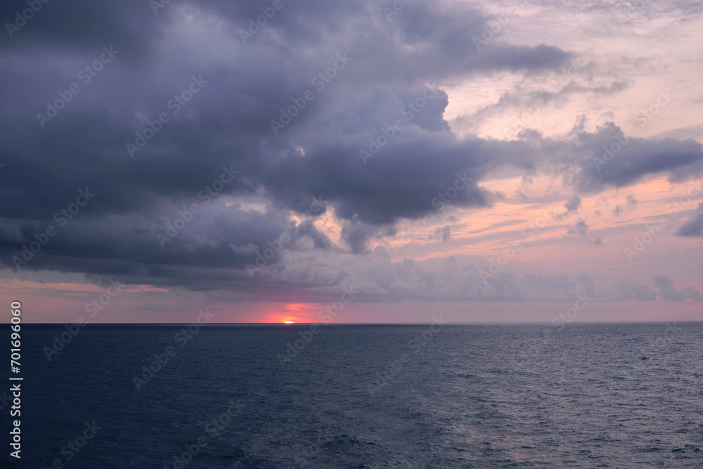 Sunset over the mediterranean sea on a cloudy day