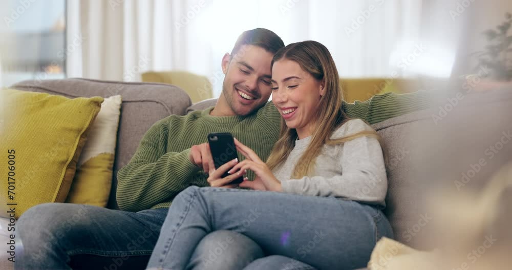 Happy, couple and reading phone with social media, meme or funny post, internet video or website for online shopping. Man, woman and talking about streaming, mobile app or relax in home on sofa Happy, couple and reading phone with social media, meme or funny post, internet video or website for online shopping. Man, woman and talking about streaming, mobile app or relax in home on sofa