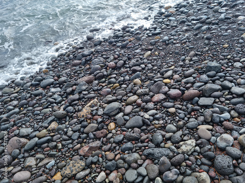  Jeju Island beach with round basalt rocks.