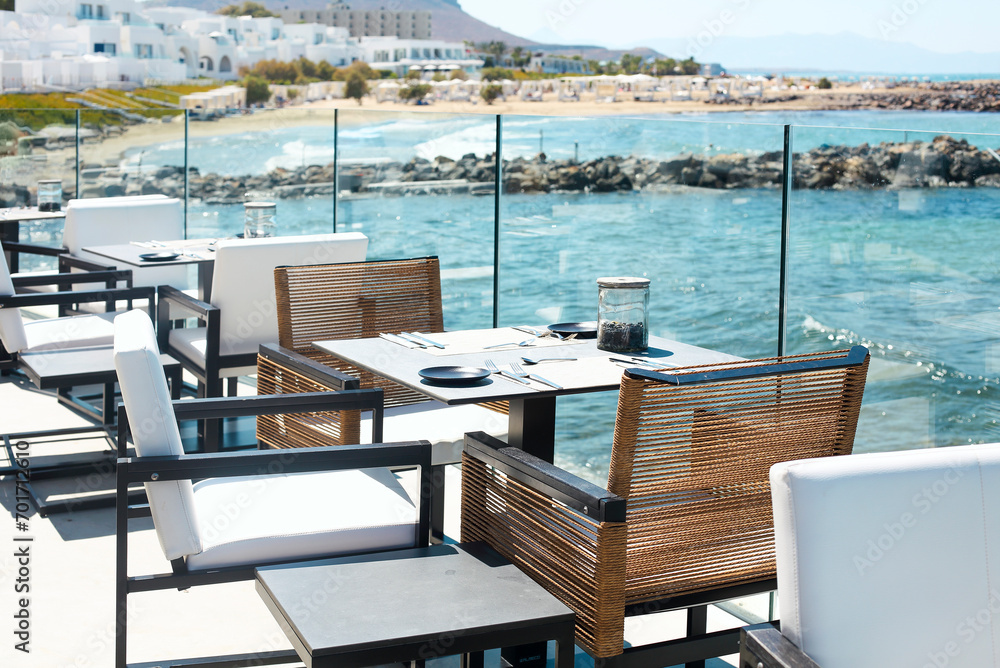 Cafe terrace near waving sea