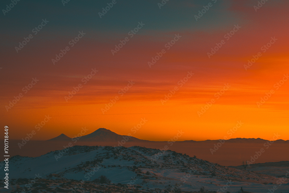 Red sunset over the Ararat mountains at winter as seen from the Aragats. Travel destination Armenia
