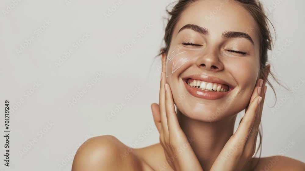 Skincare. Woman with beautiful face touching healthy facial skin. Woman smiling while touching her flawless glowy skin with copy space for your advertisement, skincare - obrazy, fototapety, plakaty 