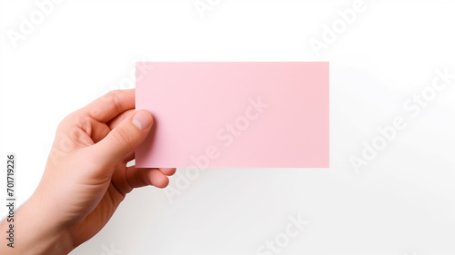 hand holding a pink paper isolated on white background