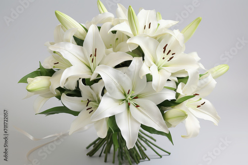 Bouquet of White Lilies on White Background Graceful white lilies in a sophisticated bouquet, radiating purity and elegance, against a white backdrop . Generative AI, © Ajrak
