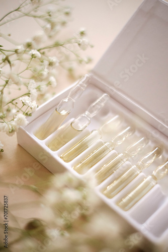 Transparent cosmetic ampoules in a box