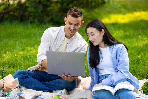 Young couple studying together and looking involved