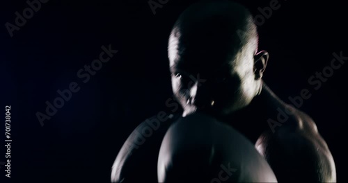 Face of athlete, speed or African boxer boxing for fitness, punch power or wellness on black background. Sport, fighter or strong man in studio ready for workout, combat training or fighting exercise photo