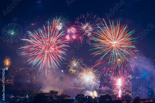 Colorful new years fireworks over the Chiang Mai City, Thailand. Celebration day in the city, night celebration way firework city. Fireworks over night. Abstract colorful firework display for holiday