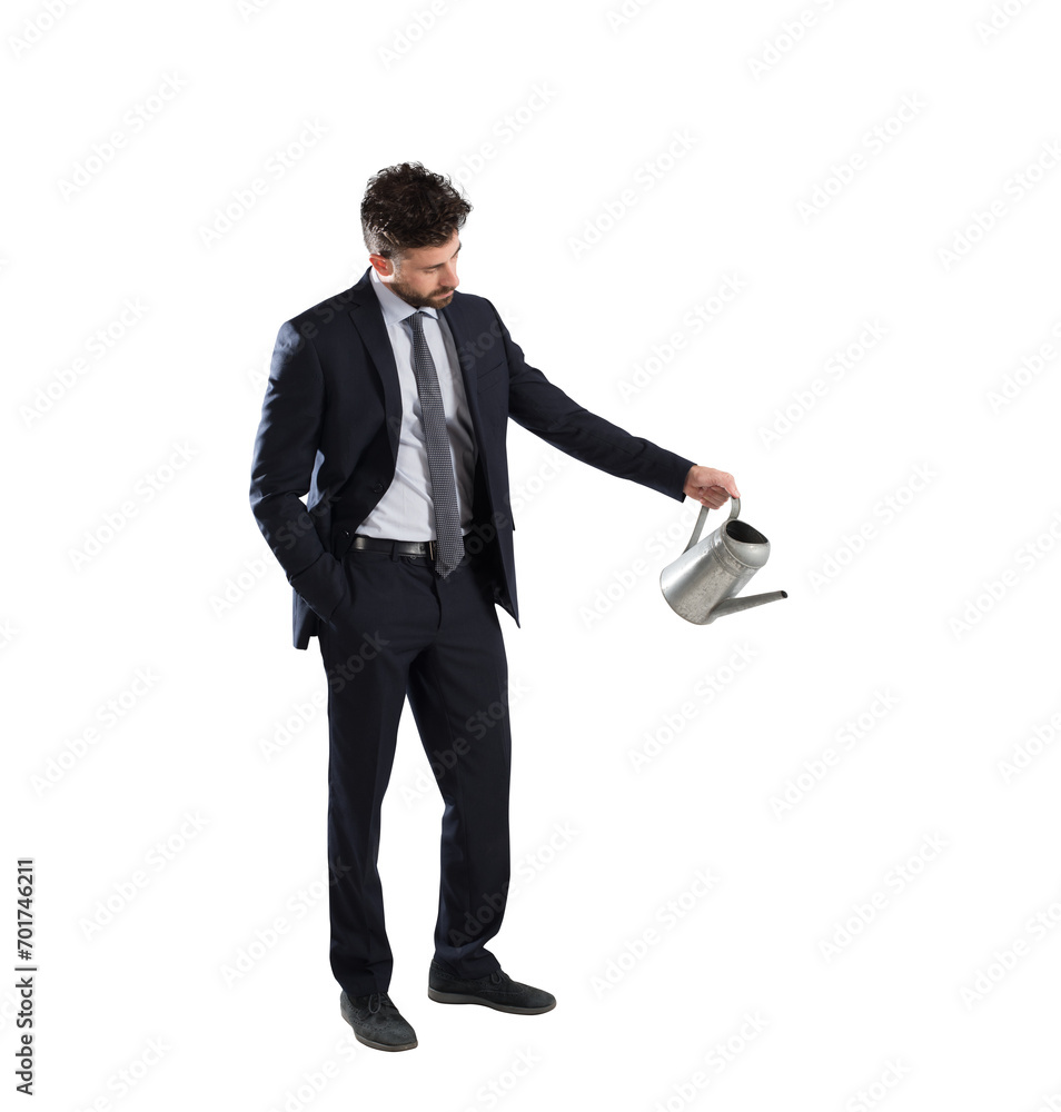 Confident businessman with watering can in hand Confident businessman with watering can in hand