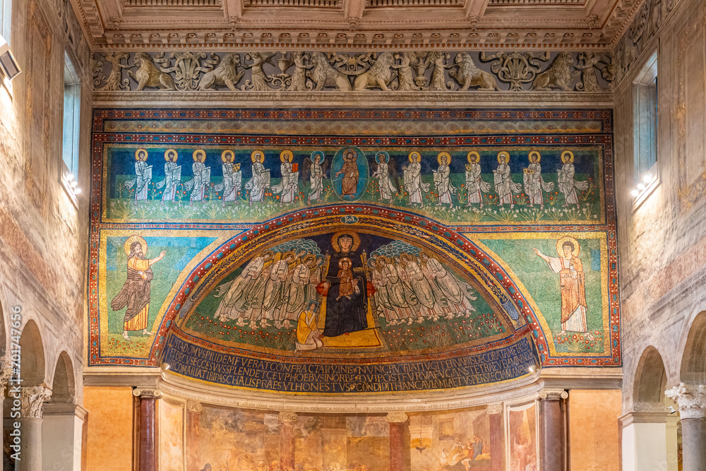 Religious frescoes and mosaics decorating the interior walls of historic Basilica in Italy