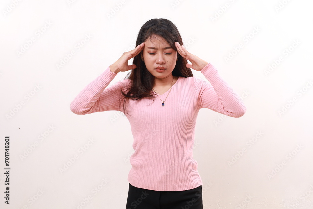 Young asian woman suffering from headache. Isolated on white background Young asian woman suffering from headache. Isolated on white background