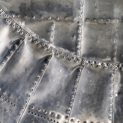 Riveted polished panels on a vintage warplane   