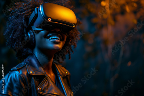Young black African American female gamer smiling and VR gaming at night