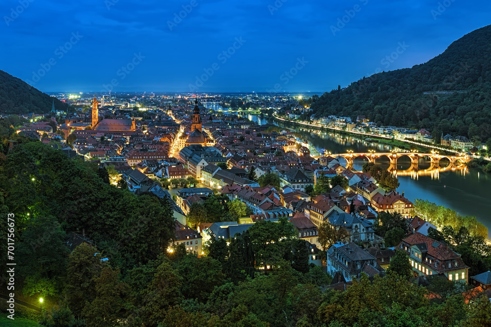 Heidelberg, Germany. Evening view over the Heidelberg Old Town with Jesuit Church, Church of the Holy Spirit and Old Bridge (Karl Theodor Bridge) across the Neckar river.