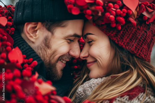 close up portrait of a handsome couple preparing to kiss inside rose petals frame. photo