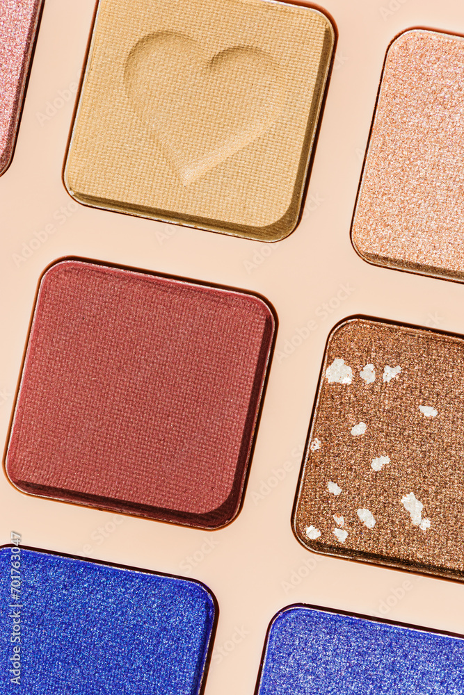 Vivid colored eye shadow makeup palette close up, colorful swatches cosmetic and beauty product, shiny eye shadow in beige package, aesthetic background textures powder for eye cosmetics Vivid colored eye shadow makeup palette close up, colorful swatches cosmetic and beauty product, shiny eye shadow in beige package, aesthetic background textures powder for eye cosmetics