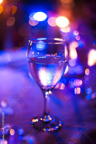 Wineglass outdoors on table by night