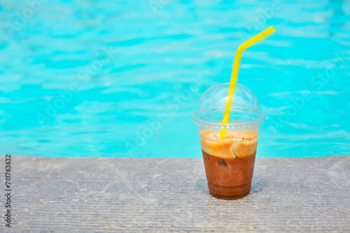 Iced coffee on outdoor poolside