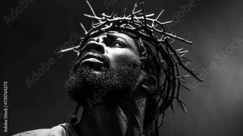 Portrait of black Jesus Christ with crown of thorns on his head. Black and white photorealistic portrait. Close-up.