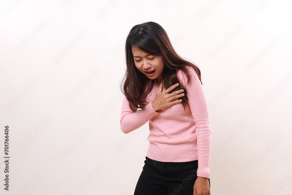 Pressure in the chest. Stressed asian woman suffering from a chest pain and touching her chest Pressure in the chest. Stressed asian woman suffering from a chest pain and touching her chest