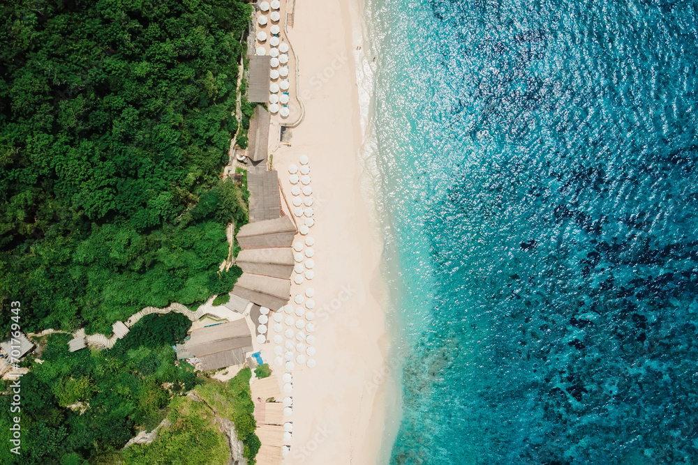 Paradise beach with turquoise ocean and resort in Bali. Aerial view - obrazy, fototapety, plakaty 