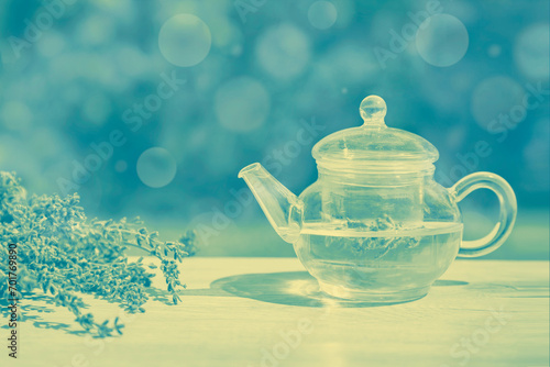 Fresh delicious tea with lavender and beautiful flowers on white marble table. duotone