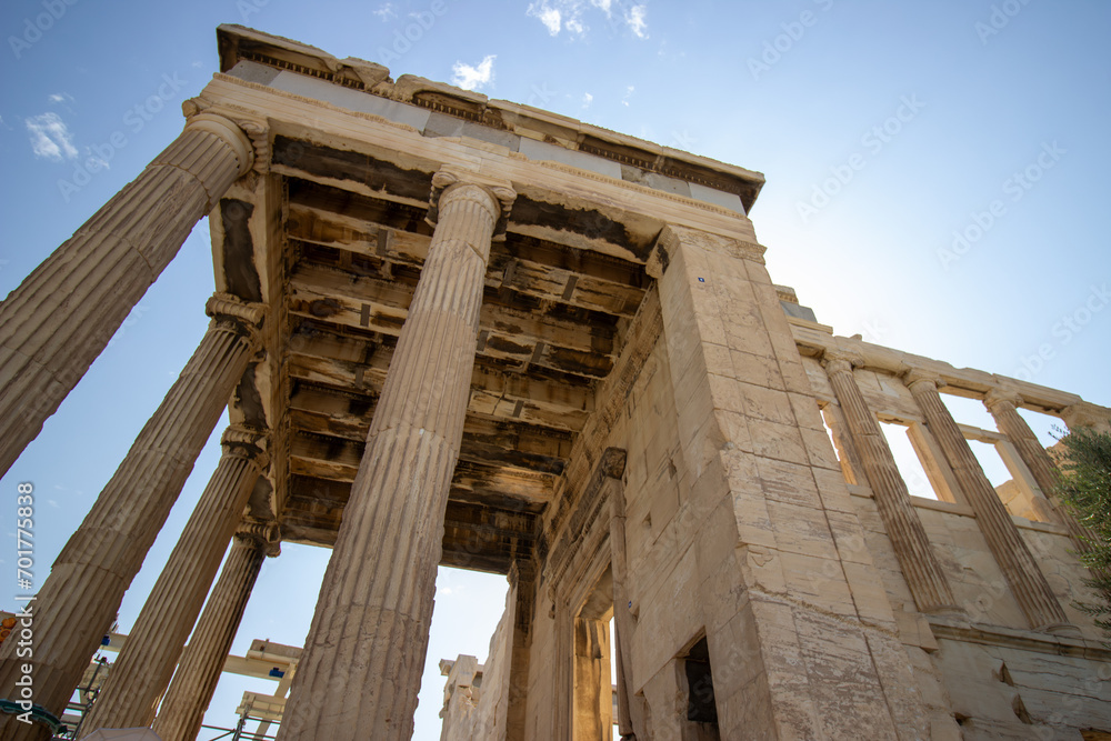 Ancient Parthenon Temple on top of the Acropolis Athens, Greece at sunny day with a blue sky. The landmark of Athens. Parthenon is the temple of for dedication to the goddess Athena.