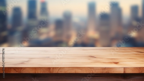 A wooden table that is empty with a blurry modern office backdrop and copy space for displaying products.
