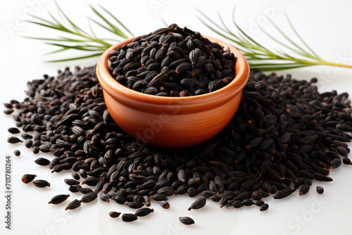 Black cumin in a bowl on the table